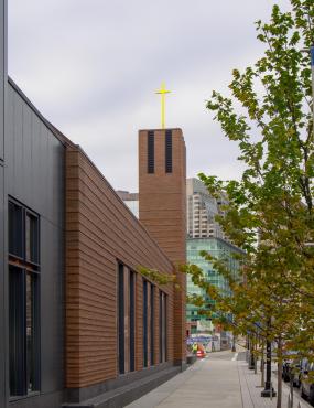 The solid metal cross replaces the need for air terminals on this modern church in Boston.
